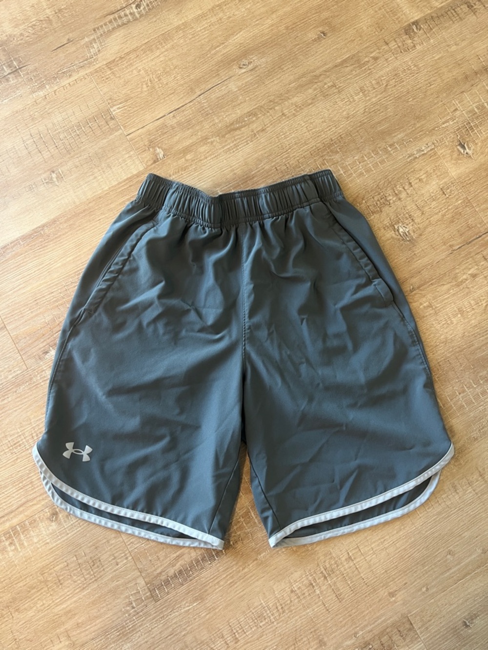 Men’s Under Armour Charcoal Gray Performance Shorts with White Trim.